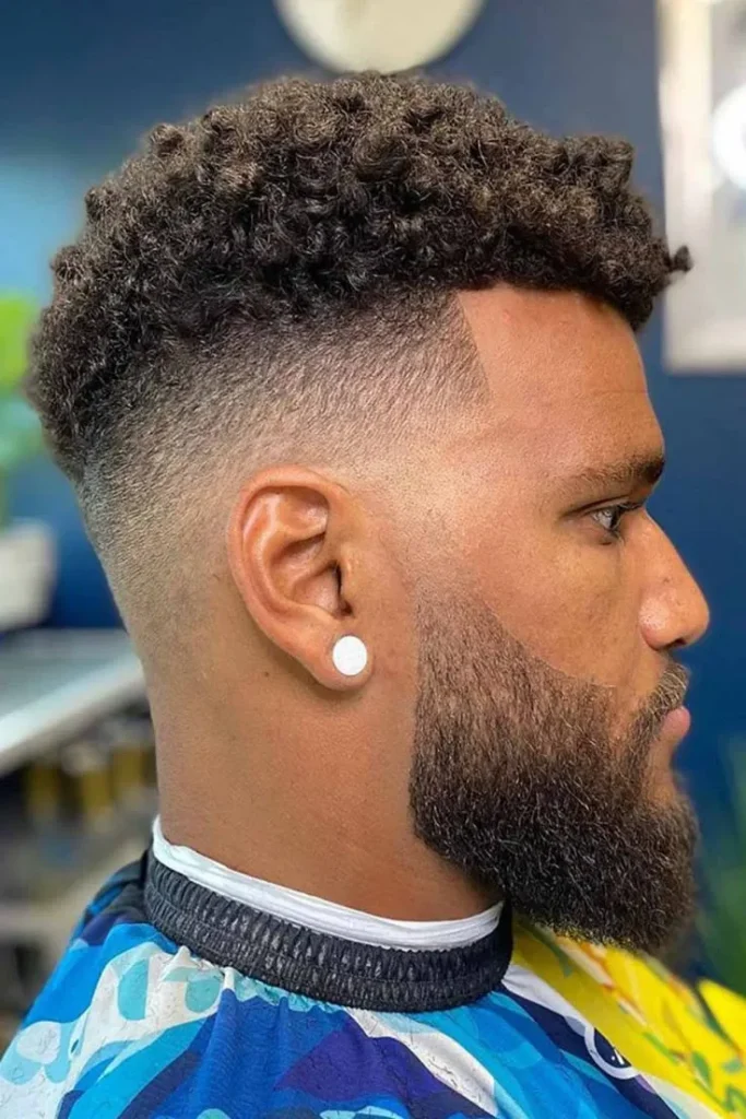 Curly Top Styled with a Mid Fade