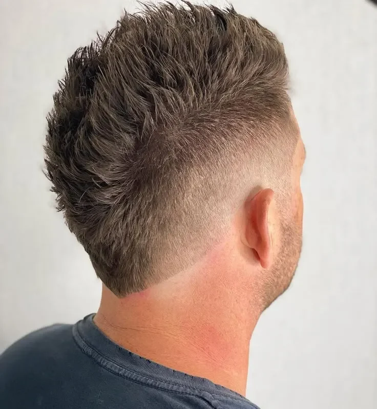  Edgy Faux Hawk with a Bold Mid Fade