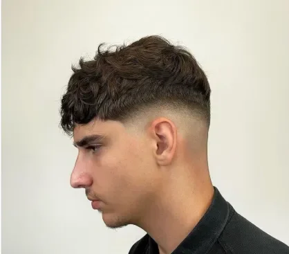 Wavy Hair Blended into a Mid Fade