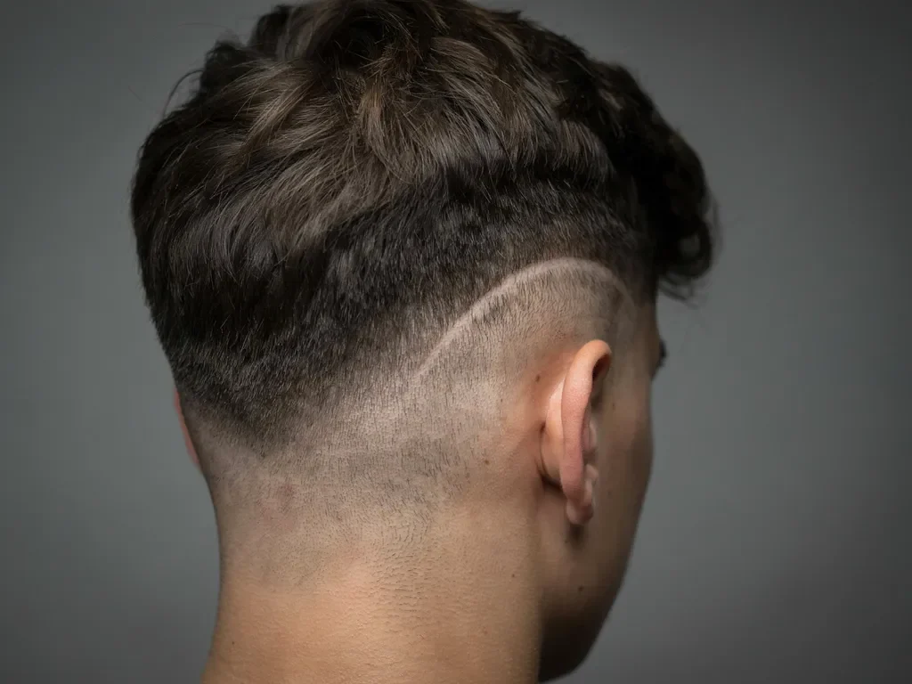 Burst fade fanning out around the ear