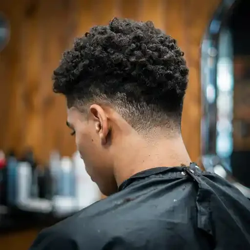 curly textured crew cut with a mid fade