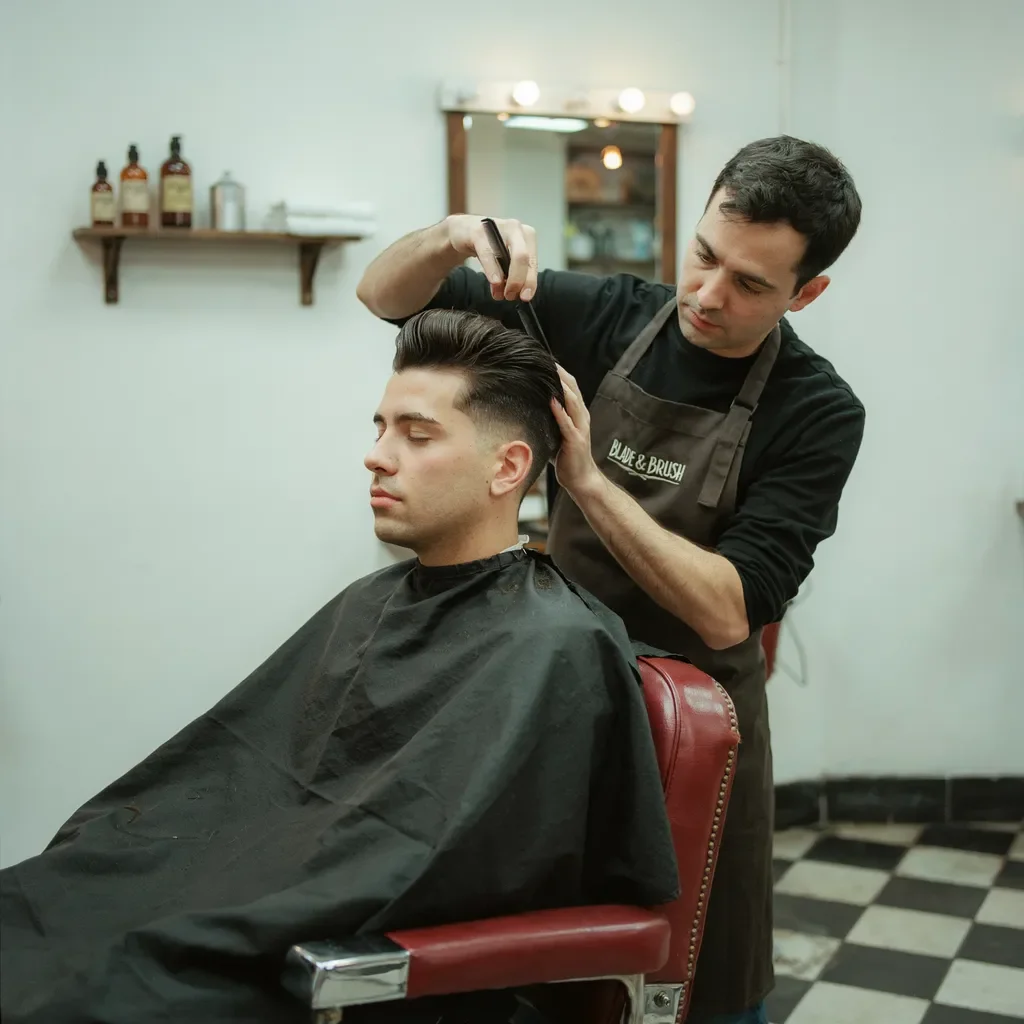 combing a pompadour into shape
