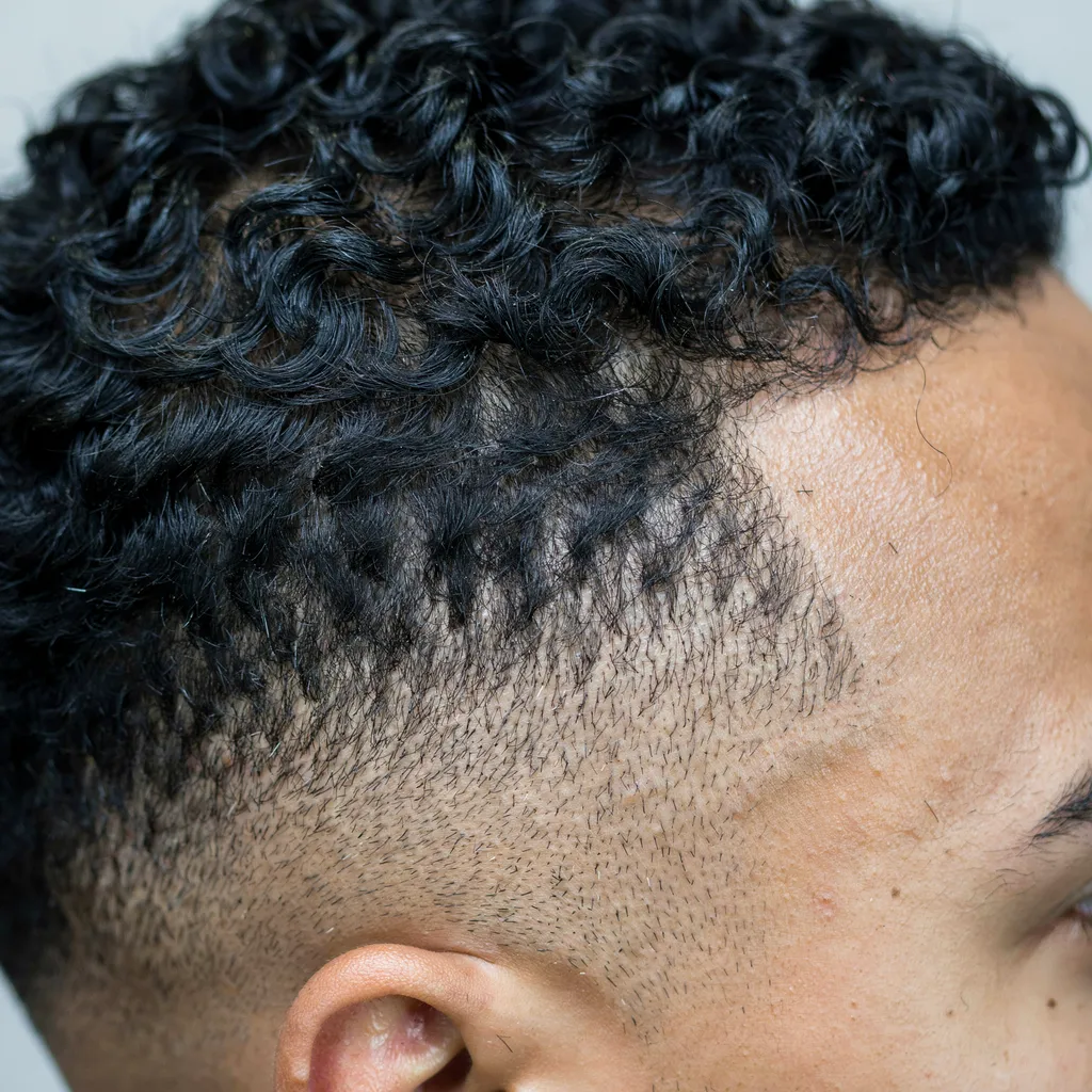 Close-up comparing hair texture and contrast at a fade blend zone