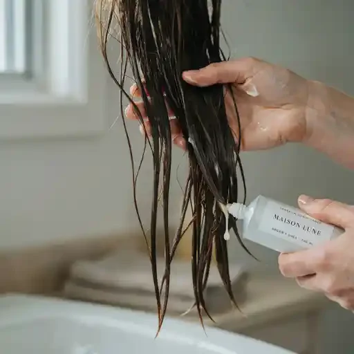 leave in conditioner applied to long hair ends