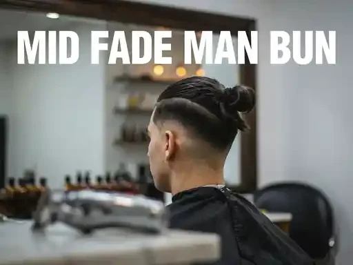 mid fade haircut with hair gathered into a man bun