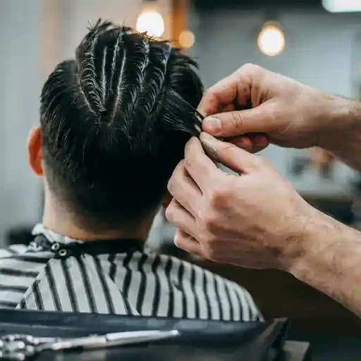 pinching hair sections to create defined spikes